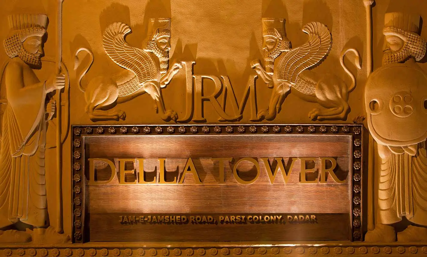 Illuminated facade of Della Tower luxury building